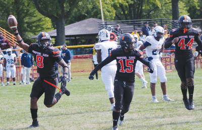  Center Line senior Amareyon Taylor (left) celebrates with senior Keyon Lawson (middle) and freshman Avery Taylor (right) against Clawson on Oct. 1. 