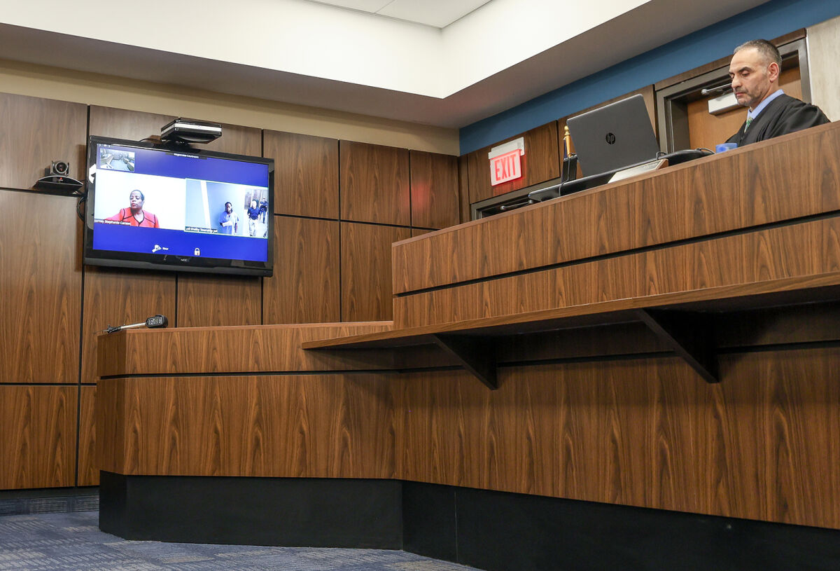  Magistrate Christopher Alayan conducts the arraignment of Sidney Davis Jr. Sept. 24 in 41A District Court in Shelby Township. 