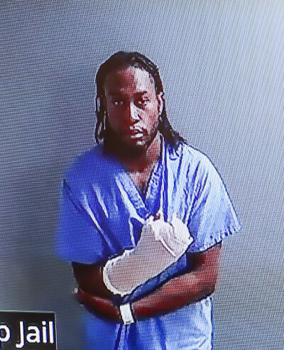 Davis had a his hand wrapped during the arraignment. He reportedly had a severe laceration on his hand when he was arrested Sept. 21. 