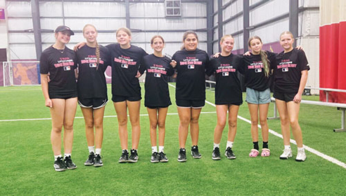  Reagan Lohr, far right, smiles with the rest of the national Little League Softball Home Run Derby contestants.  