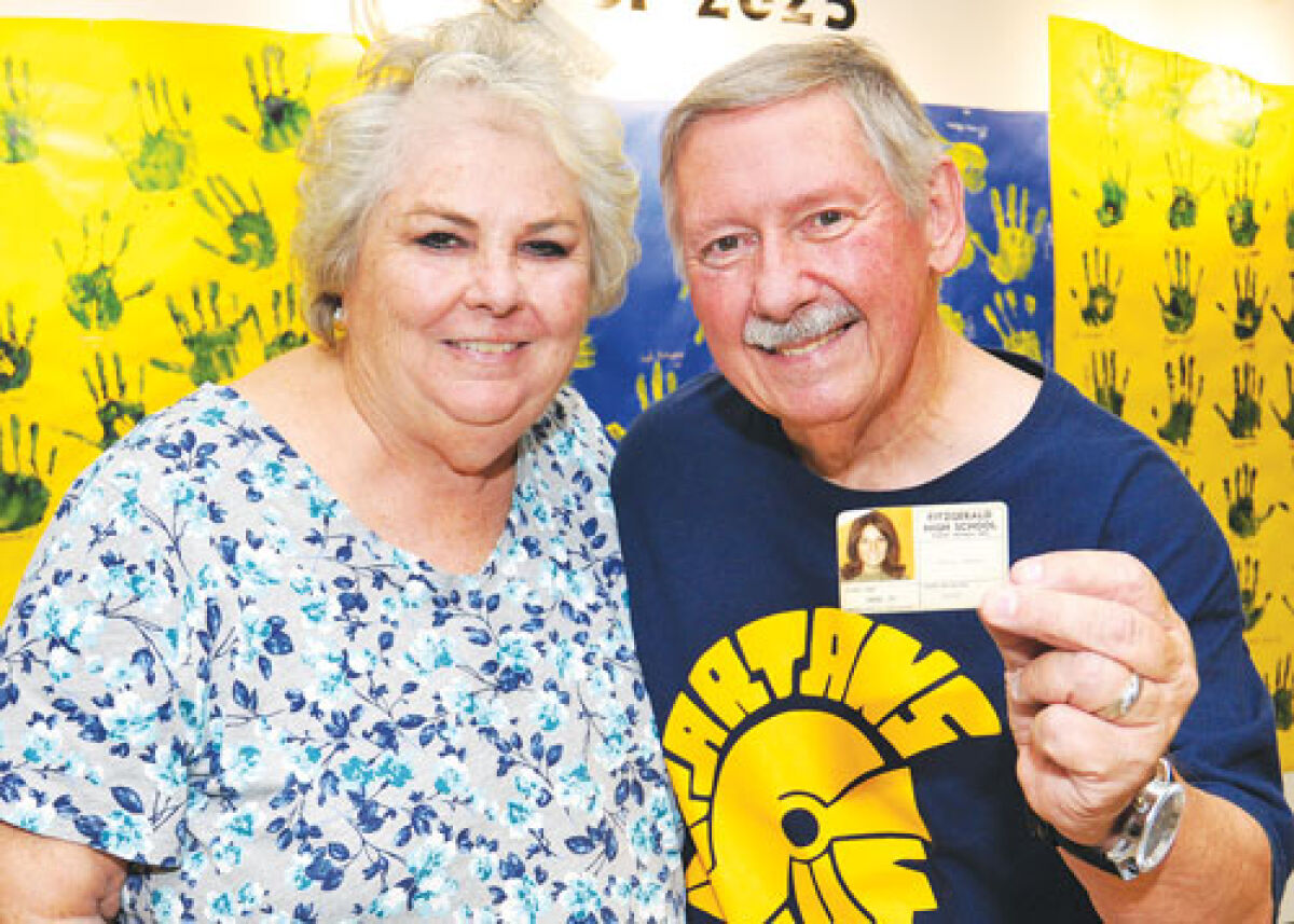   Cheryl and Dave Spurrier met in algebra class at Fitzgerald High School and later married. David is holding the 1970-1971 school ID badge of Cheryl that he keeps in his wallet at all times.  
