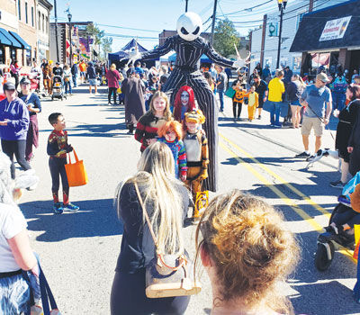  Jack Skellington and Sally from “The Nightmare Before Christmas” greet children in 2024 at the Nightmare on Auburn Road. 