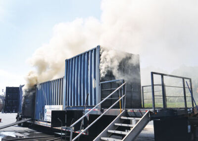  Dense smoke pours from an Oakland Community College fire training container at Pier Park in Grosse Pointe Farms.  Photos by Liz Carnegie 