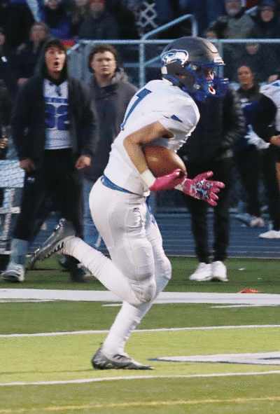  Eisenhower senior Luke Aniel carries the ball against Dakota. 