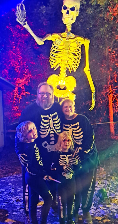  The Brown Family, of Sterling Heights — Dave, Tammy, 9-year-old Alex and 6-year-old Andy — pose for a picture wearing their skeleton costumes during their annual trip to Glenlore Trails Sept. 27. 
