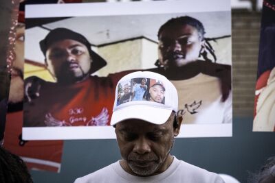  Cedric Hayden Sr. bows his head in prayer during a vigil for his son, Cedric Hayden Jr., and his friend DeJuan Pettis on Sept. 30, the one-year anniversary of their deaths. 