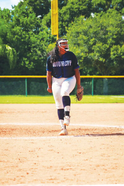  Sasha Walker lets out a yell on the field after a pitch. 
