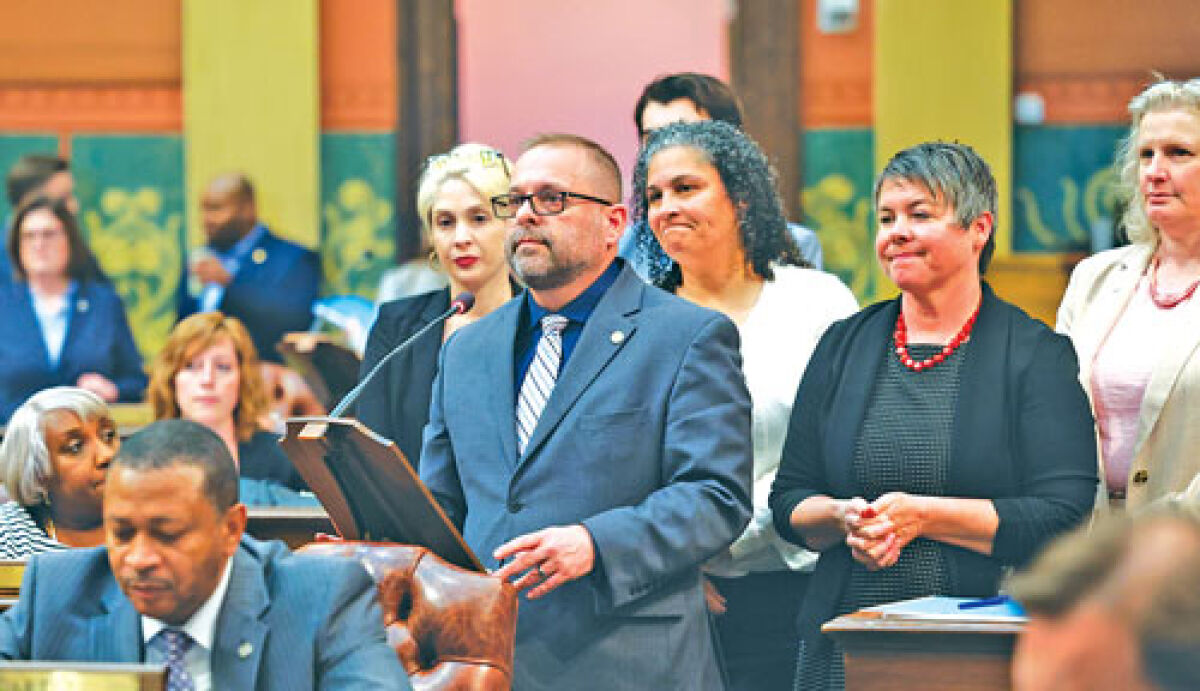  State Rep. Mike McFall, D-Hazel Park, speaks on the floor of the state House at the Capitol building in Lansing about House Bill 5063, a proposal that aims to provide tax credits for individuals who foster animals. 