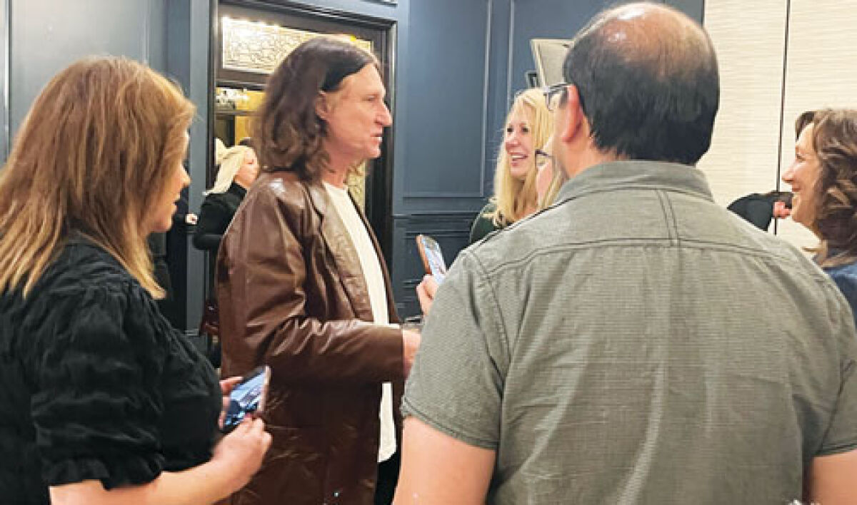  John Waite talks to a group of fans who attended his concert Sept. 27 at the Andiamo Celebrity Showroom in Warren. 