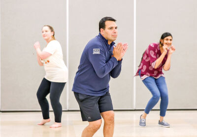  Assistant to the City Manager Katherine Oppermann, City Manager Victor Cardenas and Councilwoman Priya Gurumurthy practice an Indian cultural dance to perform at Diwali Fest. 