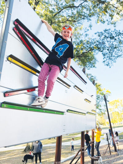  Kids try out the new equipment at the park, which is located near 12 Mile and Campbell roads. 