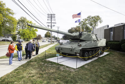  Spectators check out an M8 tank on display at the Michigan Military Technical and Historical Society during the tank’s dedication ceremony Friday, Oct. 17, in Eastpointe. 