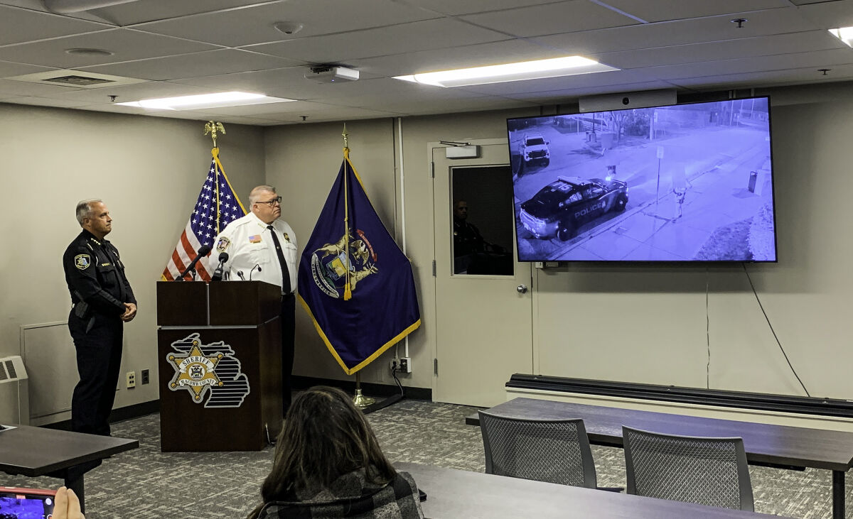  At an Oct. 23 press conference at the Macomb County Jail training room in Mount Clemens, Macomb County Sheriff Anthony Wickersham, left, and Roseville Police Chief Mitchell Berlin watch as security camera footage is shown from an incident that led to an officer-involved shooting earlier this month. 