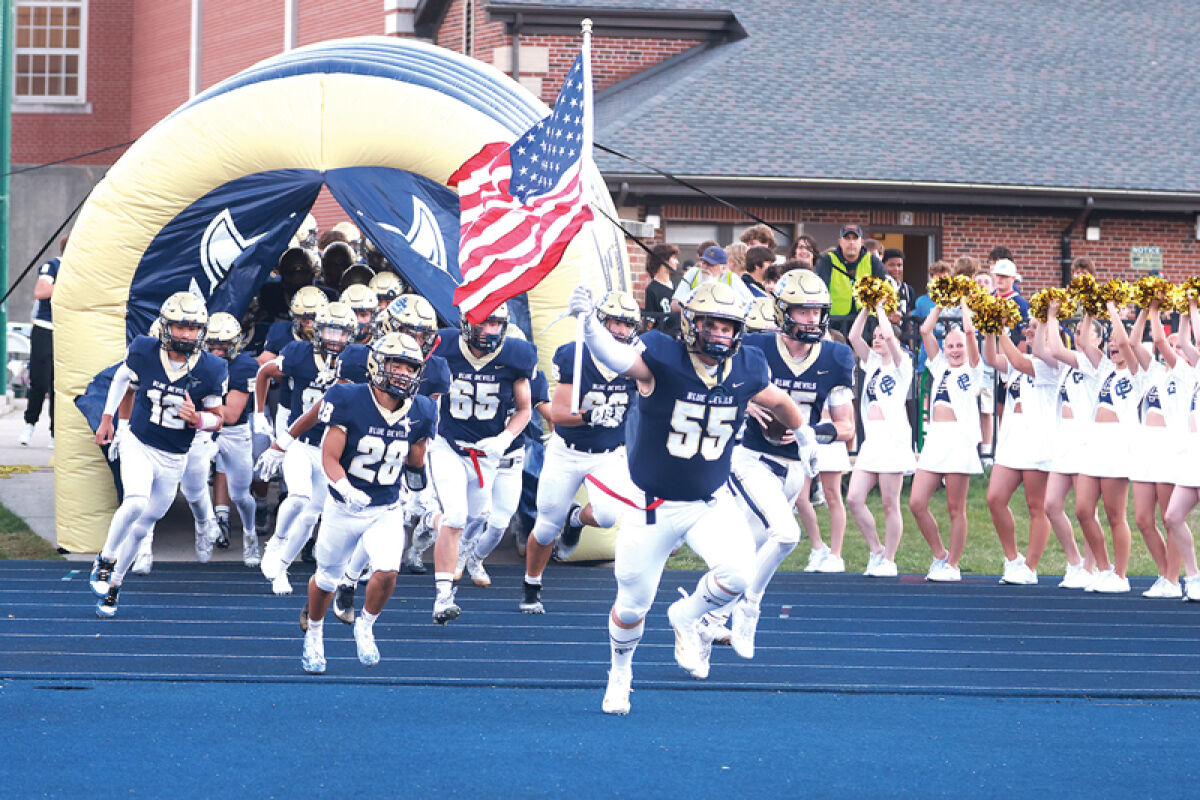  Grosse Pointe South takes the field in a game against Harrison Township L’Anse Creuse. Grosse Pointe South won 29-7. 