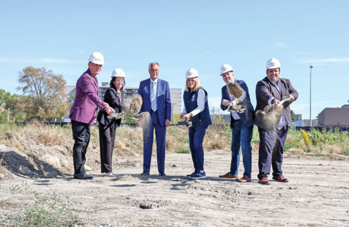  Macomb County Executive Mark Hackel, left, Mount Clemens Mayor Laura Kropp, housing developer Jim Geroge, state Rep. Denise Mentzer, state Sen. Kevin Hertel and state Rep. Joe Aragona stand or toss dirt for the ceremonial groundbreaking of the Manchester Mount Clemens apartment complex on Oct. 10. 
