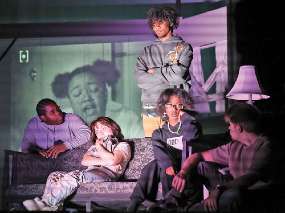  A group of survivors find a TV in a farmhouse and listen to a news broadcast in a scene from Hazel Park Drama’s upcoming “Night of the Living Dead.” 