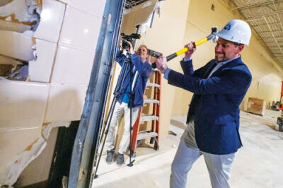  Sterling Heights Mayor Michael Taylor takes a sledgehammer to a wall inside the property that will be renovated to become the city’s new pickleball facility during a groundbreaking ceremony Oct. 23. 