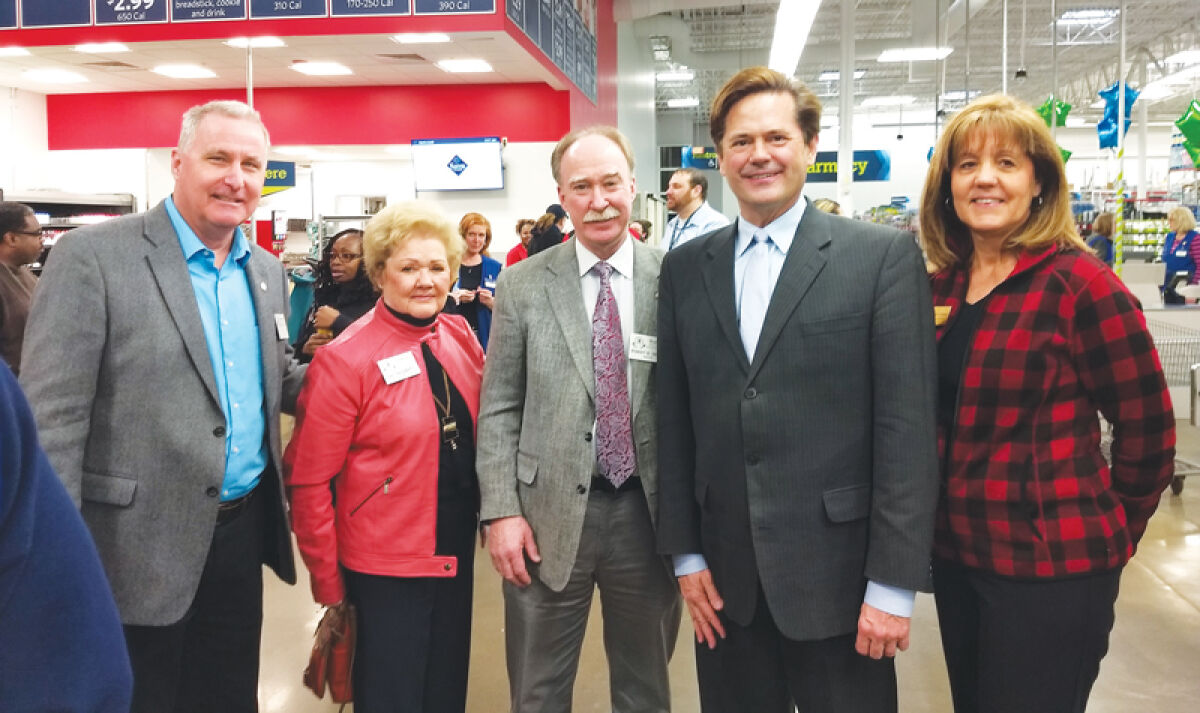  From left, Roseville City Councilman Steve Wietecha, Councilwoman Jan Haggerty, Mayor Robert Taylor, district court Judge Steven Bieda and Eastside Community Chamber Executive Director Linda L. Weishaupt pose for a photo after a ribbon cutting at the remodeled Sam’s Club in Roseville. 