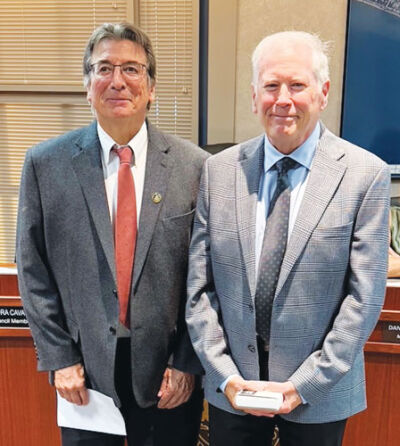  From left, Grosse Pointe Shores Mayor Ted Kedzierski recognizes longtime Shores Planning Commission member Patrick McCarroll for his years of service during a Sept. 16 council meeting. 
