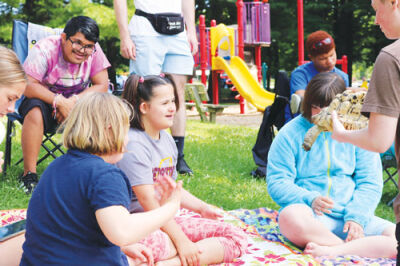  A mobile reptile show visits the Rochester-Avon Recreation Authority SCAMP, a special needs summer camp 