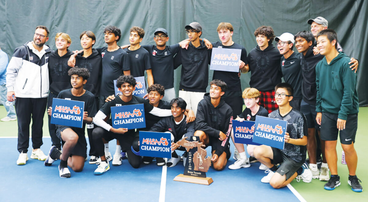  The Troy High boys tennis team poses with the MHSAA 2025 Division 1 trophy at Midland Tennis Center Oct. 18. 