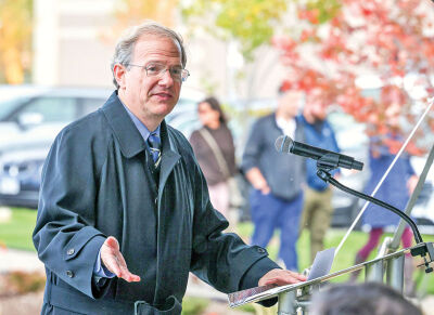  Sakura Novi partner Scott Aikens addresses a crowd during the dedication of the Sakura garden. 