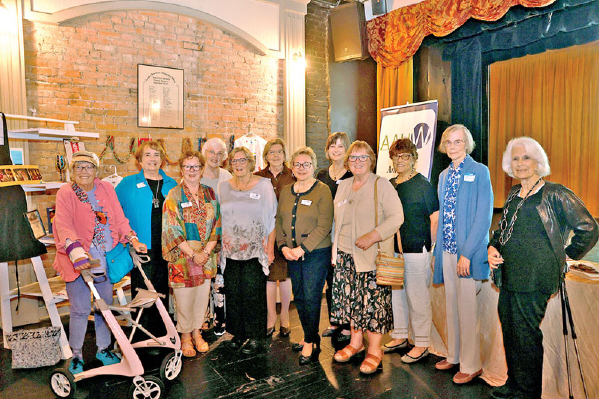  Members of the American Association of University Women Northville-Novi pose for a picture at the group’s 50th anniversary celebration at Genitti’s Hole in the Wall in Northville Sept. 24. 