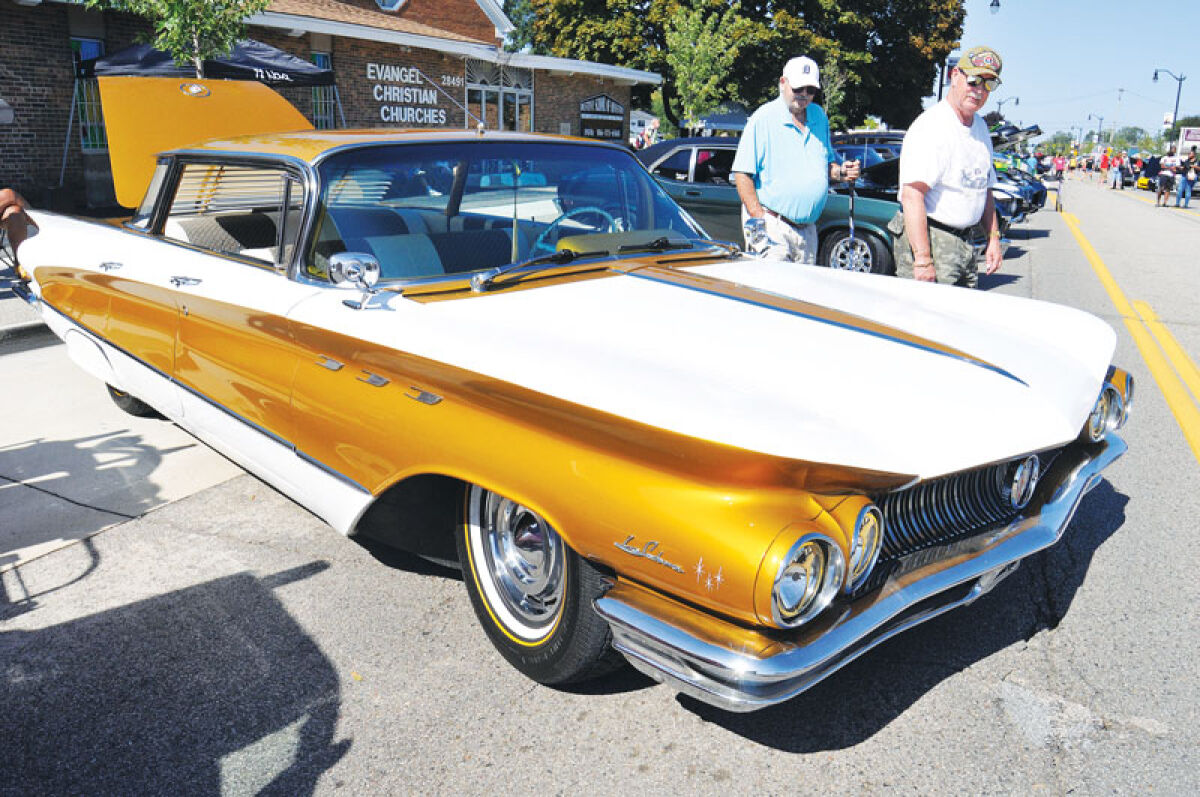  The custom paint on a 1960 Buick LeSabre is eye-catching as spectators walk around Jammin’ at the Junction Sept. 27 in Roseville. 