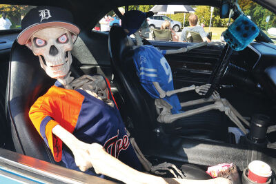  Two skeletons pay homage to the Detroit Tigers, left, and the Detroit Lions in a 1973 Dodge displayed at the 25th annual Holy Cross Classic Cruisers show Sept. 28 at Holy Cross Lutheran Church in Warren. 
