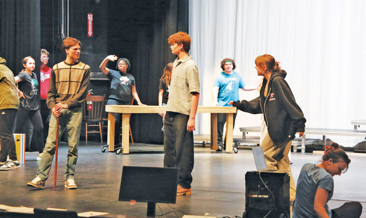  Carnival workers and attendees fill the scene at the Oct. 16 rehearsal for Chippewa Valley High School’s production of the musical “Tuck Everlasting.” 