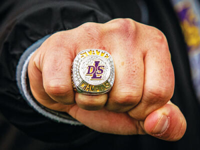  Warren De La Salle head coach Thaier Makhtar shows off his state title ring.  De La Salle has now won the championship in consecutive seasons.  
