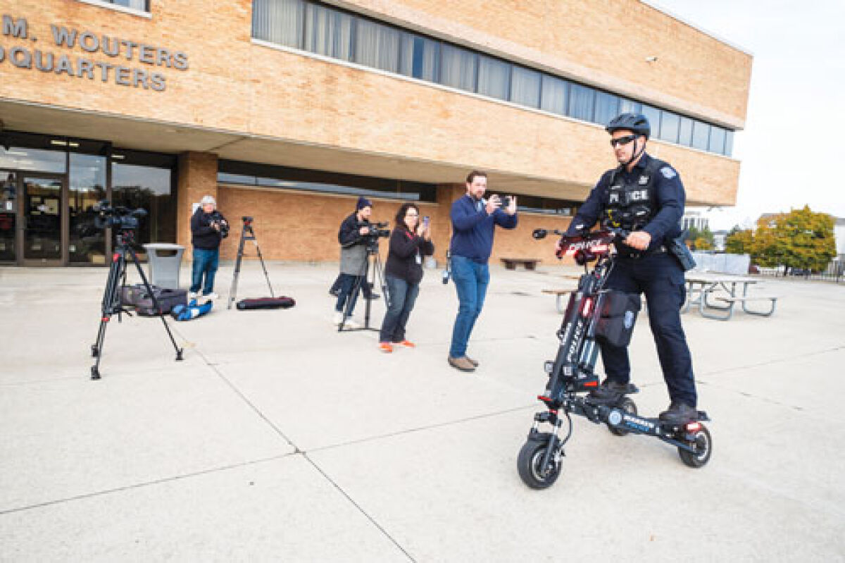  Officer Thomas Hogue of the Warren Police Department demonstrates one of the new electric  scooters on Oct. 31.  