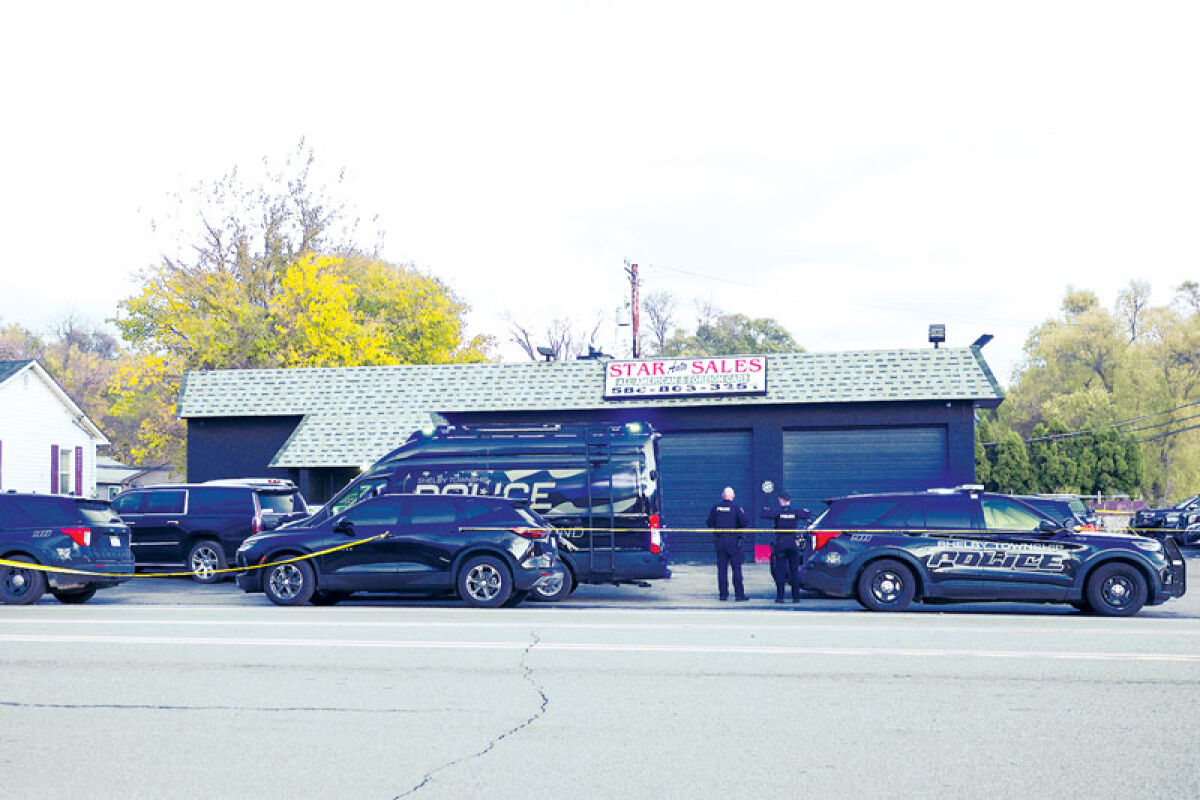  Shelby Township police investigate a double homicide at Star Auto Sales on Ryan Road, north of Auburn Road, Nov. 7. 
