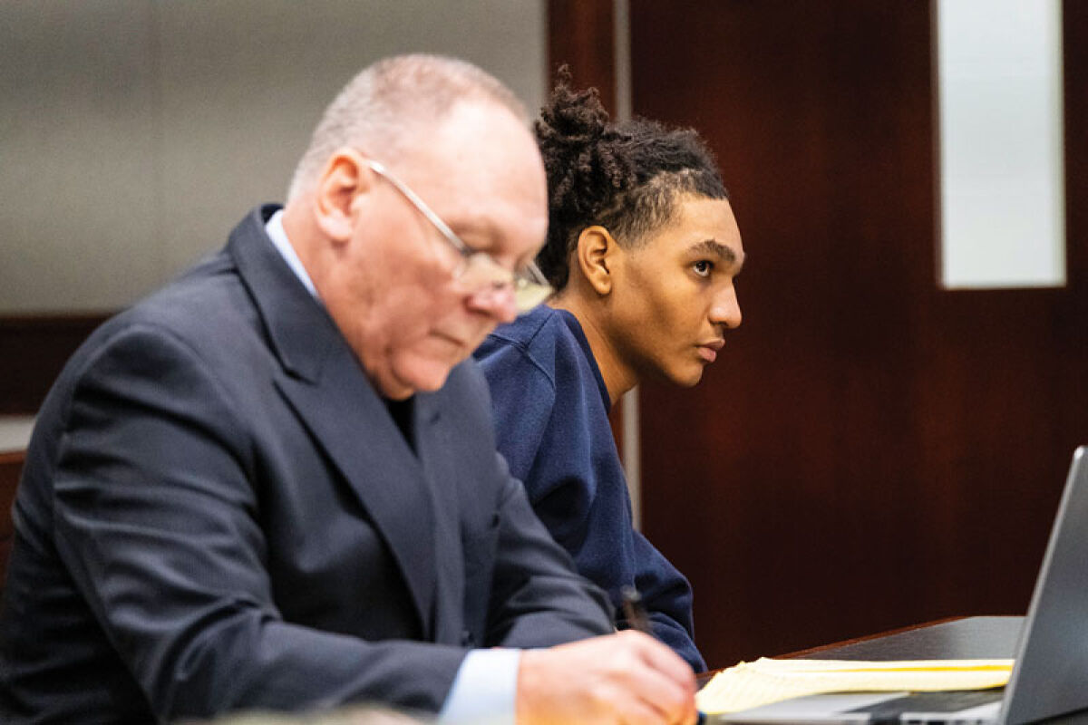  Daniel Shane Canales, 16, is seated next to his defense attorney, Robbie Lang, during his preliminary exam Monday, Nov. 3, in the 41B District Court in Clinton Township. 