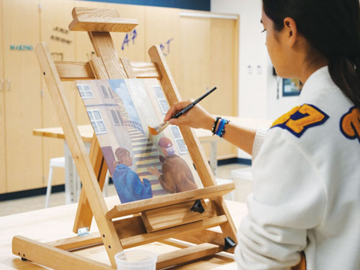  A Marian High School student paints in the new Wanink Art Wing.  
