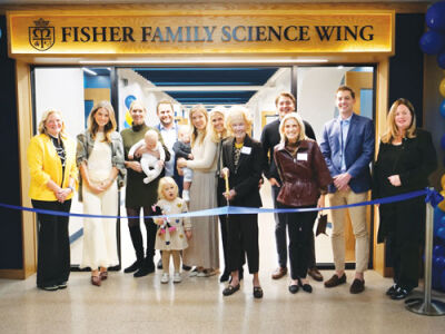  The Fisher family cuts the ribbon on  Marian High School’s Fisher Family Science Wing. 