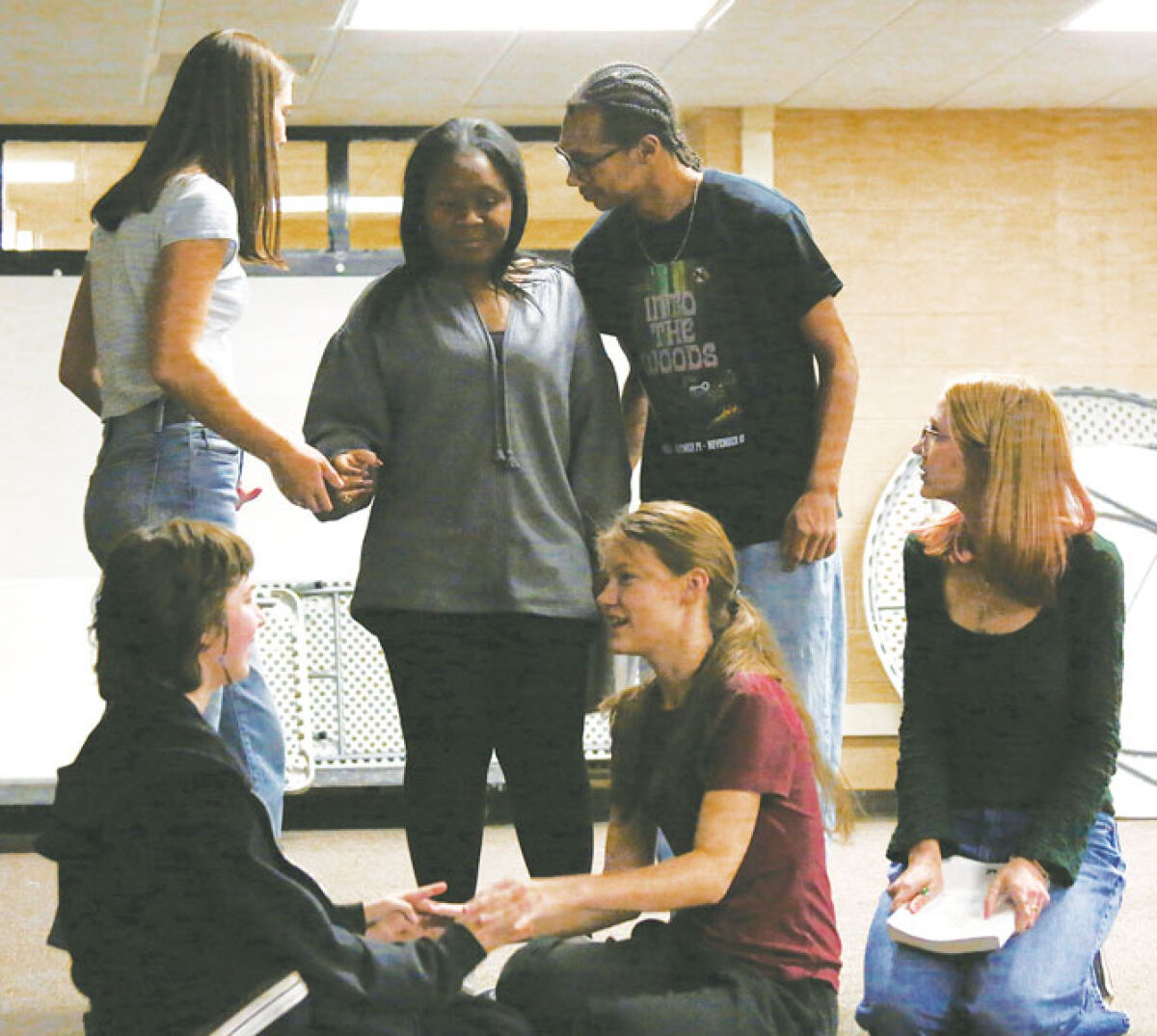  Some of the core characters of L’Anse Creuse High School-North’s production of “Into the Woods” — Baker’s Wife (sophomore Natalie Bolak, top left), Witch (senior Jada O’Neal), Baker (junior Rylie Ellis), Jack (sophomore Sarah Murphy, bottom left), Milky White the cow (junior Marley Flieger) and Jack’s Mother (senior Lilly Hill) — assemble the magic potion toward the end of the first act. 