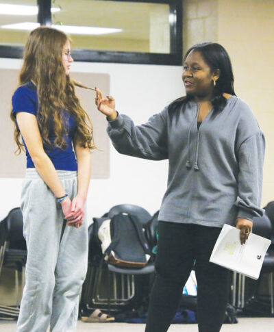  The Witch (senior Jada O’Neal, right) confronts Rapunzel (freshman Alex Sakowski) during the “Stay with Me” number. 