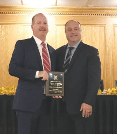  Eastpointe Public Safety Director George Rouhib, right, honors Detective Ian Reinhold as Eastpointe Police Officer of the Year. 