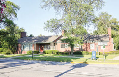  The existing building — a vacant doctor’s office — looks more like a house. It would be torn down to make way for a new development, if rezoning is approved. 