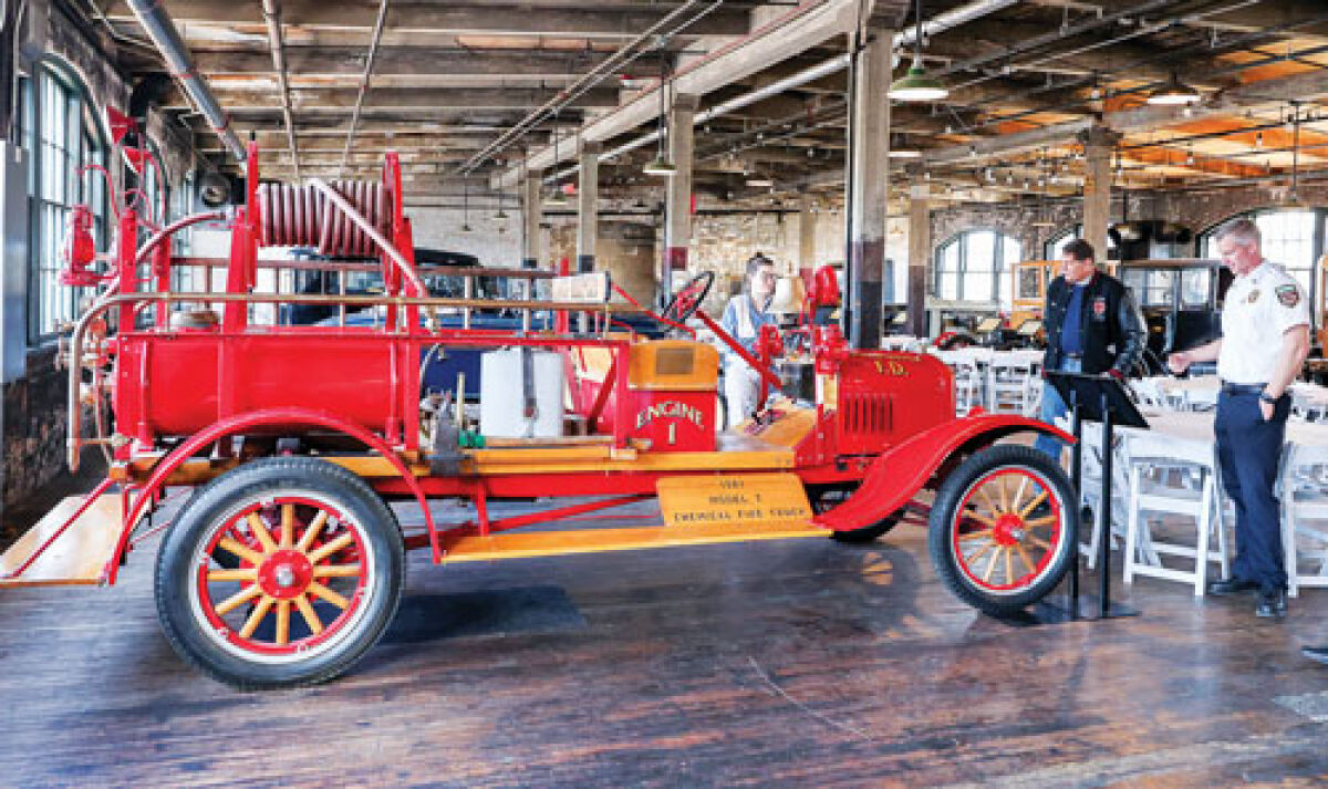  Samantha Wilkinson, Ford Piquette Avenue Plant Museum operations manager left; retired Eastpointe Fire Chief Danny Hagen, center; and Eastpointe Fire Chief Jason Clark discuss Eastpointe’s 1921 Model T chemical fire truck.  