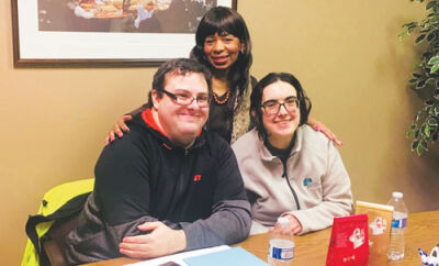  Colette Hughes, center, owner and broker of Virtual Real Estate Services in Warren, makes her clients a top priority in servicing all real estate needs.  