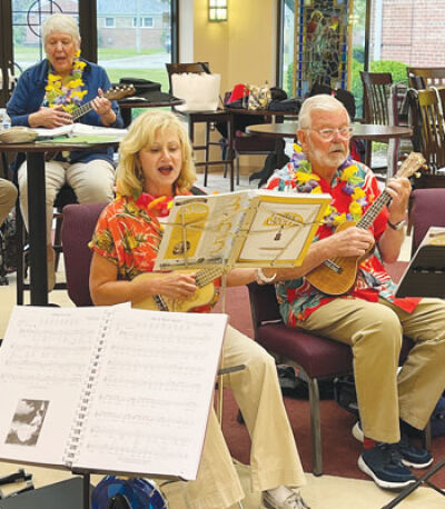  Suzanne Ladouceur, of St. Clair Shores; Amy Fiddler, of Harrison Township; and Colt Weatherston, of Grosse Pointe Farms, practice with the ukulele group. Fiddler says she takes her ukulele with her everywhere she goes. 
