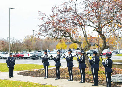 The Southfield Police Department provides a 21-gun salute.