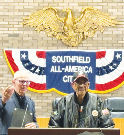  Southfield Mayor Ken Siver presents Korean War veteran James Elias Jackson, 91, with a certificate. 