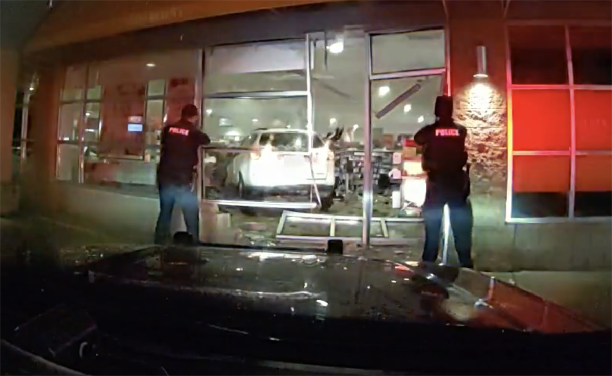  An image from Royal Oak police dash cam footage shows police approaching an SUV that crashed into Ulta Beauty on Woodward Avenue Nov. 9. 