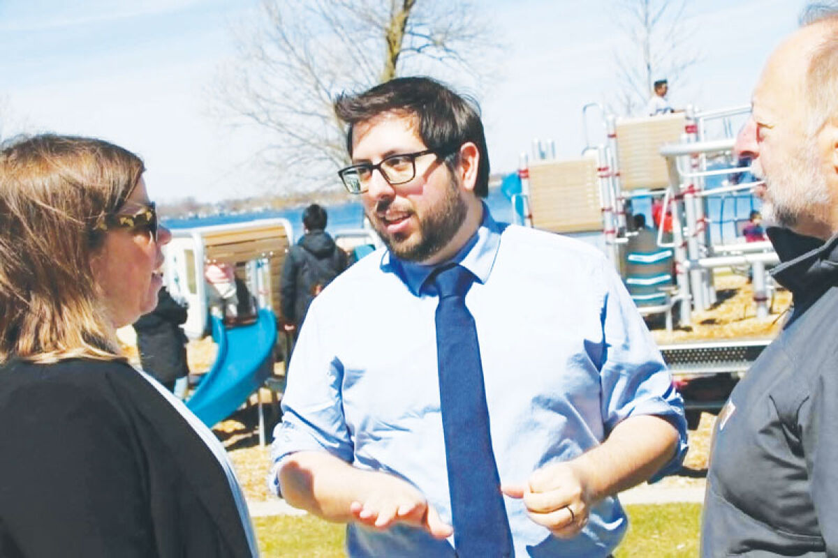  Novi’s newest City Council member is Aaron Martinez, center. 