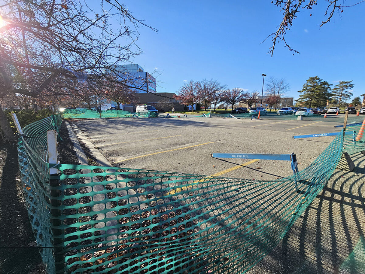  A parking lot at Oakland University is blocked off after the university discovered a leak in the hot water pipe system, an underground loop that supplies heat to every main campus building.  