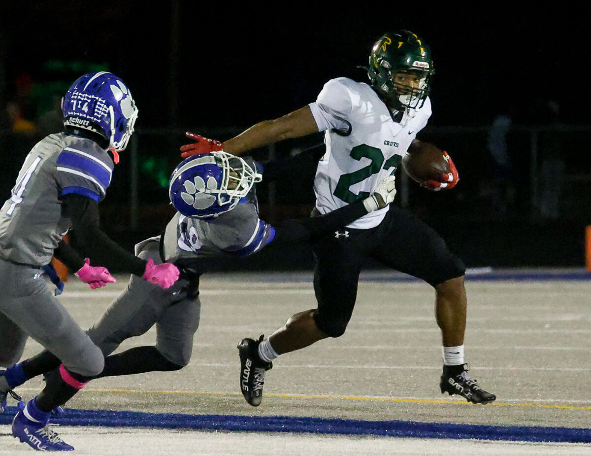  Groves junior Jeremiah Whitley sheds a tackle from Lakeview’s K’alon Williams. 