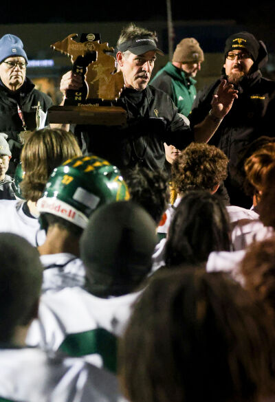  Groves head coach Brendan Flaherty talks to the team after Groves’ 37-14 regional final win over Lakeview on Nov 14 at Lakeview High School. 